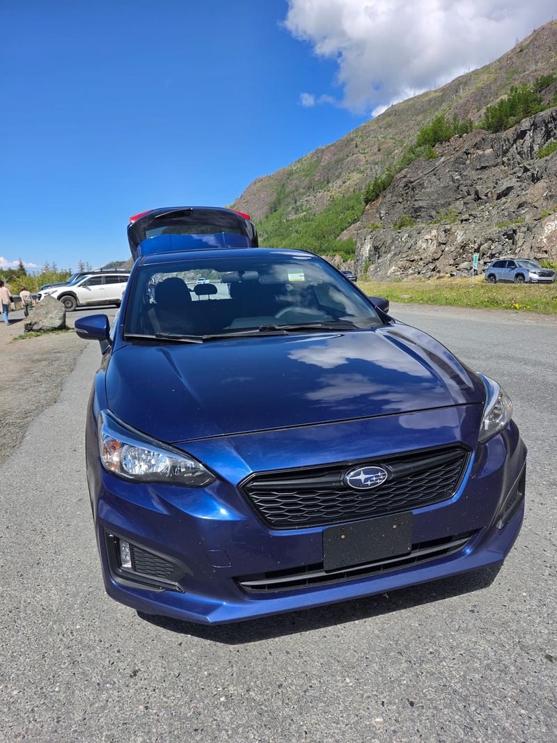 Subaru Impreza seen from the front at a roadside pullout