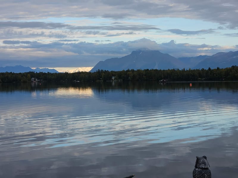 Lake Lucille at dusk with the mountains behind