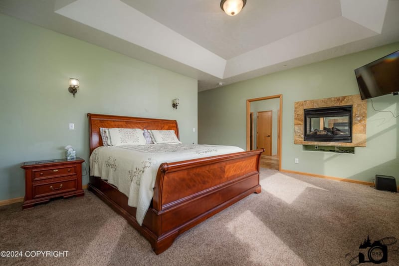 Primary bedroom with a king sleigh bed