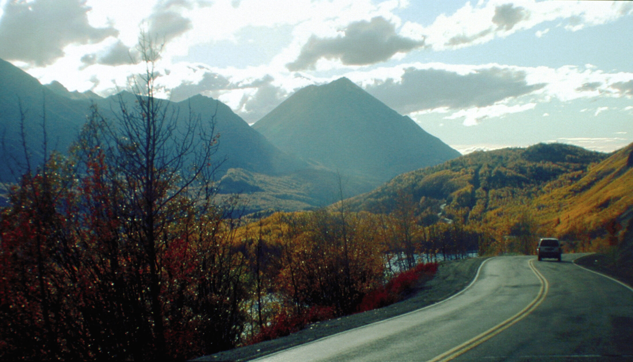 The Glenn Highway curving past autumn hillsides toward King Mountain